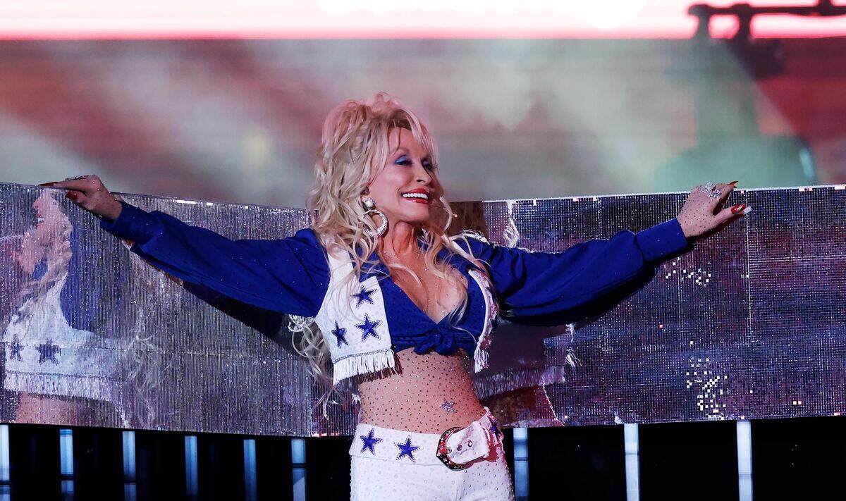 Dolly Parton performs during the Dallas Cowboys’ halftime show to kickoff the Red Kettle Campaign on Thursday, November 23, 2023, at AT&T Stadium in Arlington.